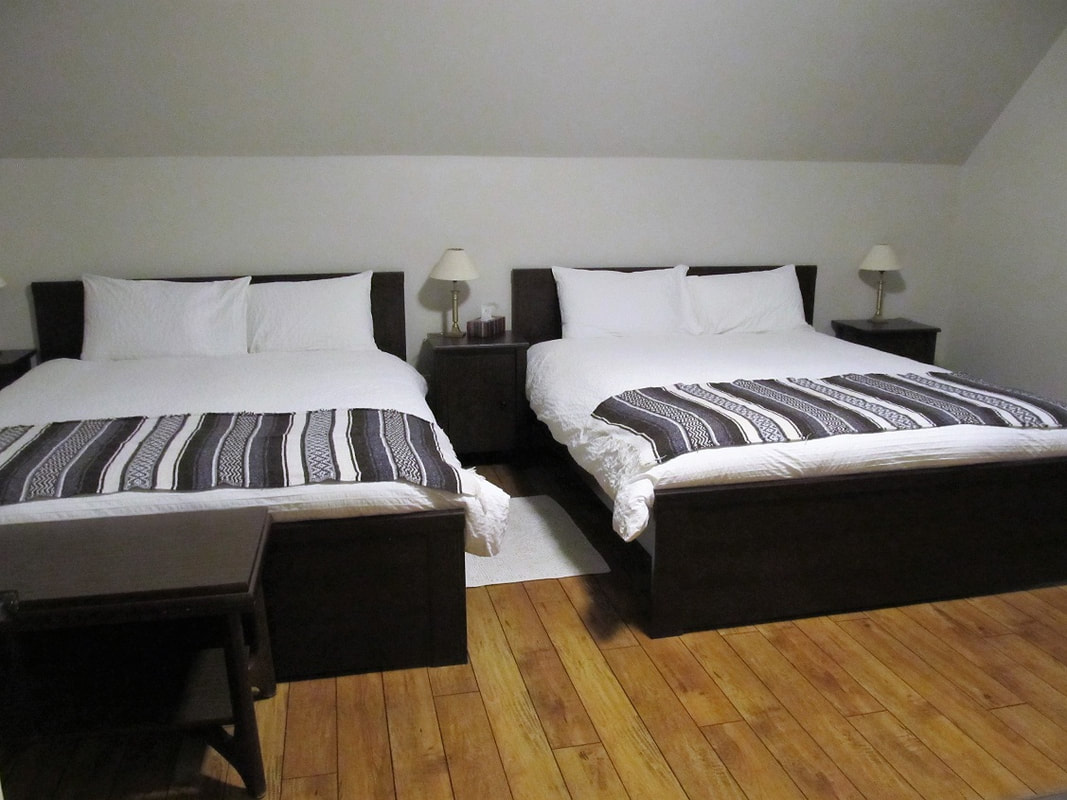 Room with two double beds